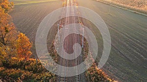 Aerial view of railway track among agricultural fields