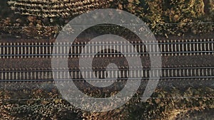 Aerial view of railway track among agricultural fields