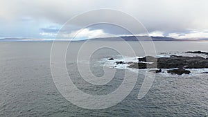 Aerial view of an rainbow above the Atlantic Ocean and Inishkeel by Portnoo in Donegal - Ireland