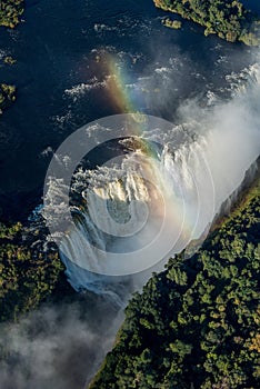 Aerial view of rainbow crossing Victoria Falls