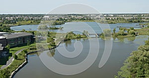 Aerial view of a recreation area with lake and bridge