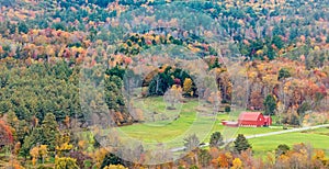 Aerial view red barn and Fall colors Berkshires