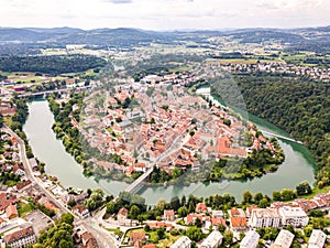 Aerial view of red roofs of Novo Mesto, Slovenia. Historic Kandija iron bridge Old Bridge, on the bend of the Krka River.