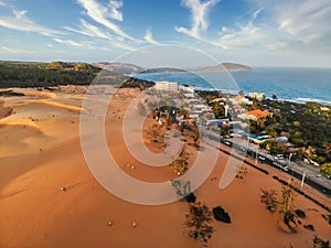 Aerial view of Red Sand Dunes local name is Doi Cat Do, also known as Golden Sand Dunes, is located near Hon Rom beach, Mui Ne,