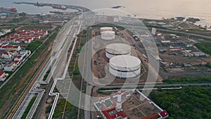 Aerial view refinery storage construction at sea. Oil fuel facility in port town