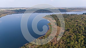 Aerial view of the reservoir dam and forest at a rural countryside