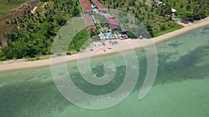 Aerial view of residental area with luxury beachfront villas by the sea on tropical island in Thailand