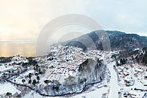 Aerial view of residential area in Molde, Norway during a cloudy day in winter photo