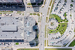 Aerial view of residential district with large parking lot in sunny summer day