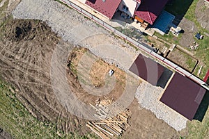 Aerial view of residential house with backyard in suburban rural area