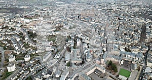 Aerial view of residential houses and ancient historical buildings of French city of Rodez in winter day