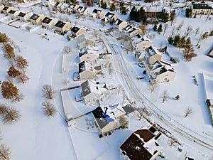 Aerial view of residential houses covered snow at winter season with snow on covered houses and roads