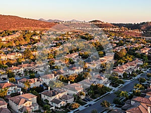 Aerial view of residential modern subdivision during sunset