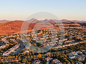 Aerial view of residential modern subdivision during sunset