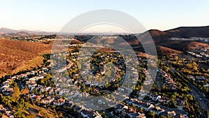 Aerial view of residential modern subdivision during sunset