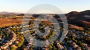 Aerial view of residential modern subdivision during sunset