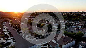 Aerial view of residential modern subdivision during sunset