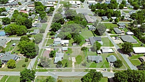 Aerial view residential suburbs houses in Checotah, McIntosh County, Oklahoma toward Broadway and Main Street with historic photo