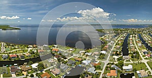 Aerial view of residential suburbs with private homes located on gulf coast near wildlife wetlands with green vegetation