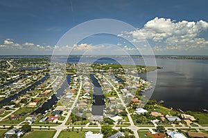 Aerial view of residential suburbs with private homes located on gulf coast near wildlife wetlands with green vegetation