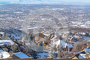 Aerial view of residential valley with homes on a mountain town on a winter day