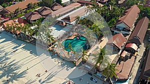 Aerial view of resort with pool on the tropical beach