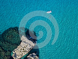 Aerial view of the Riaci rocks, Riaci beach near Tropea, Calabria. Italy. Bathers who swim and snorkel