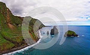 Aerial view of Ribeira da Janela volcanic sea stacks in Madeira island, Portugal photo