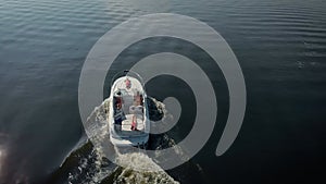 Aerial view. A rich man on his boat. Beautiful female models are resting on a yacht.