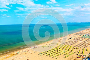 Aerial view of Rimini beach with people, ships and blue sky. Summer vacation concept.