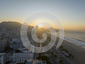 Aerial view of Rio de Janeiro, Copacabana beach. Skyscrapers beaches. Sidewalks and streets. Sugarloaf wrapped in cloud. Brazil