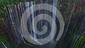 Aerial view rise up to reveal Tumpak Sewu waterfall, East Java, Indonesia