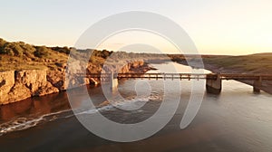 Aerial view of river bridge showcasing engineering feat infrastructure and aerial perspectives photo