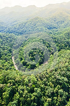 Aerial view of a river deep in the Teak forest near Thailand-Myanmar border, rainy morning. Mae Hong Son, Thailand