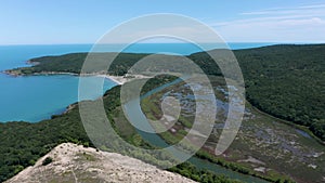 Aerial view of a river that flows into the sea