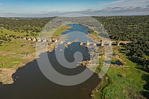 Aerial view of the river Guadiana and the historic Ajuda Bridge