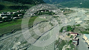 Aerial view of river and Mestia village with Svan towers