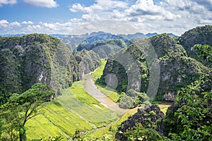Aerial view of the river among rice fields and limestone mountains, vietnamese scenic landscape at ninh Binh Vietnam