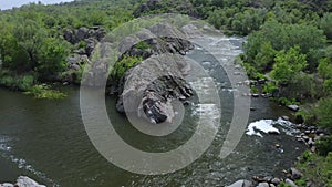 Aerial view of a river taking a hard corner in the rocky landscape.