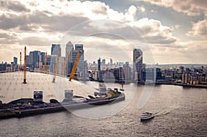 Aerial view of River Thames, North Greenwich and the Docklands on a cloudy day in London, England