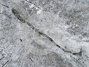 Aerial view of river in winter forest covered with snow. drone photography. Russian winter landscape