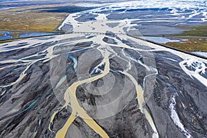 Aerial view of a riverbed and water streams in Iceland