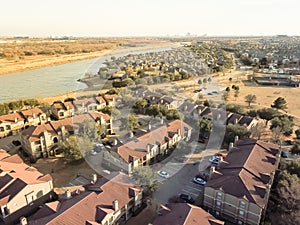 Aerial view riverside apartment buildings complex in Irving, Tex