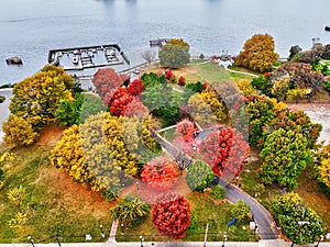 Aerial View of a Riverside Park with Fall Colors