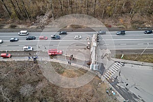 Aerial view of road accident with overturned truck blocking traffic