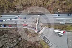 Aerial view of road accident with overturned truck blocking traffic