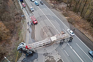 Aerial view of road accident with overturned truck blocking traffic