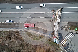 Aerial view of road accident with overturned truck blocking traffic