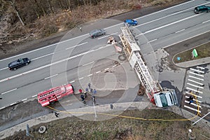 Aerial view of road accident with overturned truck blocking traffic