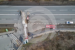 Aerial view of road accident with overturned truck blocking traffic